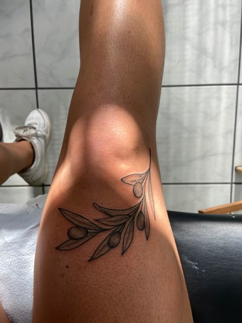 Leaf Tattoos For Women Leg, Knee Tattoo Plant, Leg Leaves Tattoo, Olive Branch Tattoo Thigh, Food Tattoo Sleeve, Olive Branch Leg Tattoo, Plus Size Tattoo Placement, Botanical Leg Tattoo, Around The Knee Tattoos Women