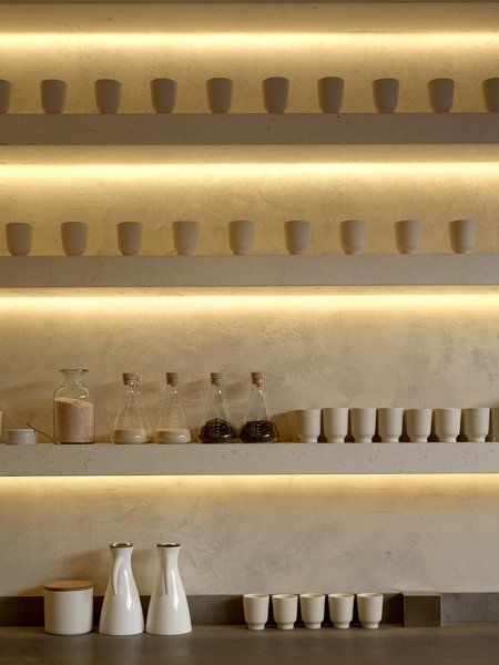 Open, backlit shelves show off simple dishware. Photo 3 of 6 in Modern Tea Shop in San Francisco. Browse inspirational photos of modern homes. From midcentury modern to prefab housing and renovations, these stylish spaces suit every taste. Samovar Tea, San Francisco Shopping, Textured Wall Panels, Tea Lounge, Kitchen Interiors, Tea Store, Tea Bar, Cafe Interior Design, Decoration Inspiration