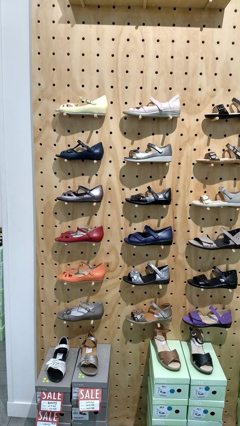 Pegboard shoe rack Pegboard Shoe Storage, Peg Board Shoe Rack, Pegboard Shoe Rack, Pegboard Shoe, Wall Shoe Rack, Gift Shop Displays, Shoes Cleaning, Pegboard Display, Shoe Store Design