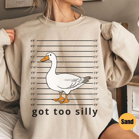 Silly Goose Sweatshirt | Got Too Silly Sweatshirt | Goose Crewneck | Silly Goose Sweatshirt | Funny Sweatshirt Gift | Gift For Him Matching T-Shirt: https://printworkshopcompany.etsy.com/listing/1789038227/silly-goose-comfort-colors-shirt-got-too ** HOW TO ORDER 1. Check our photos for sizing and color options.  2. Select your size and color from the drop-down menus.  3. Click "ADD TO CART" to add the shirt to your cart. 4. Click "PROCEED TO CHECKOUT" to purchase your sweatshirt. ** VIP Email Li Cute Funny Sweatshirts, Funny Crewneck Sweatshirt, Silly Goose Shirt, Goose Quotes, Got Too Silly, Goose Sweatshirt, Too Silly, Silly Clothes, Silly Shirt