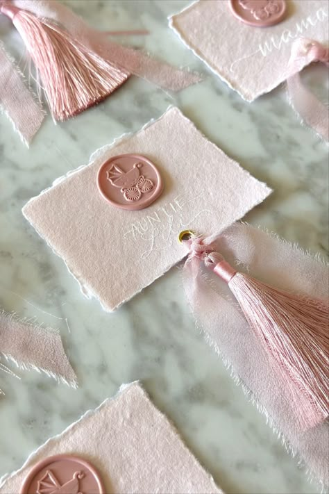 Welcome your baby shower guests to their seats with our gorgeous handmade paper place cards with tassels and wax seals written in calligraphy. Bridgerton Place Cards, Tassel Place Cards, Baby Shower Seating Ideas, Elegant Baby Shower Ideas, Placecard Ideas, Handmade Paper Place Cards, Welcome Cards, Baby Shower Place Cards, Baby Pink Wedding