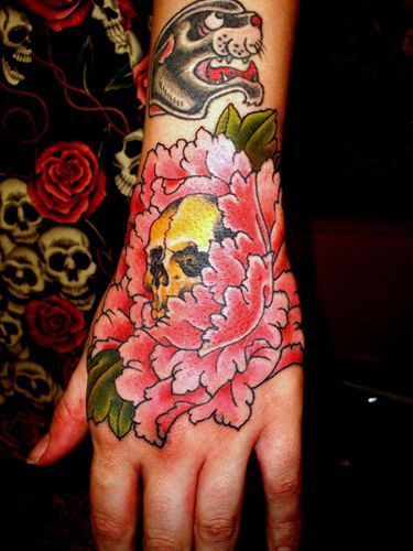 Top Hand Tattoos | Inked Magazine Top Hand Tattoos, Hand Tattoo Flower, Skull Hand Tattoos, Tattoos For Women Hand, Typewriter Tattoo, Enough Tattoo, Skull Hand Tattoo, Japanese Flower Tattoo, Tattoo Floral