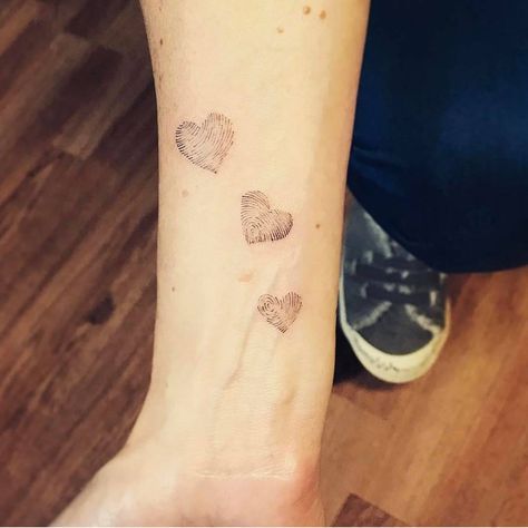 Family fingerprints tattoo on the inner forearm. 3 Thumbprint Tattoo, 3 Finger Print Tattoo, Three Thumbprint Tattoo, Family Finger Print Tattoo, Finger Print Tattoo Ideas Family Trees, Three Fingerprint Tattoo, Family Fingerprint Tattoo, Thumbprint Flower Tattoo, Finger Print Flower Tattoo