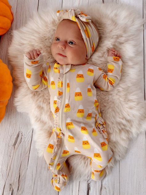 Treat yourself to our classic Halloween favorite. Enjoy this iconic holiday candy displayed as a sweet print on super soft fabric (96% viscose from bamboo and 4% lycra).This footie is not only buttery soft, but also adorable with its ruffle detailing along zipper and bottom. The two-way zipper feature allows for quick and easy diaper changes, without having to fully undress your little one. Plus, the enclosed feet and fold-over mittens provide warmth and protection, while the ruffles add a touch Cute Newborn Outfits, Infant Outfits, Fall Baby Clothes, Baby Bells, Classic Halloween, Baby Fits, Holiday Candy, Dream Baby