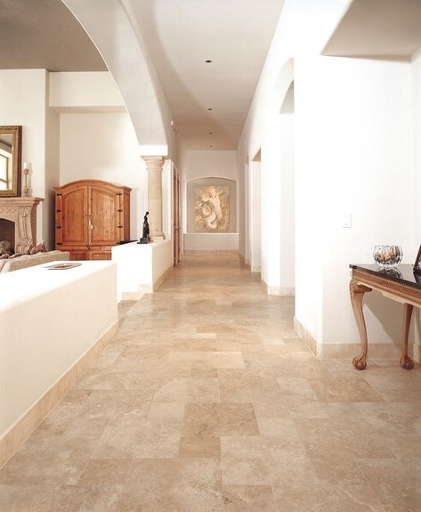 Wood Baseboards vs. Tile Baseboards | Hunker Tile Baseboard, Stone Entryway, Travertine Floor, Wood Baseboard, Travertine Floor Tile, Dining Room Remodel, Travertine Floors, Living Room Tiles, Wood Tile Floors