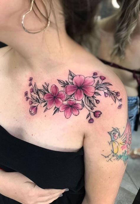 Flower Tattoos Archives - TattManiaTattMania Floral Collar Bone Tattoo Color, Shoulder Color Tattoos For Women, Tattoo Color Mujer, Colorful Floral Shoulder Tattoo, Flower Tattoos Lower Back, Color Shoulder Tattoo, Colored Flowers Tattoo, Color Flower Tattoos For Women, Pink Flowers Tattoo