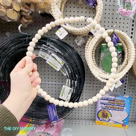 Easy Beaded Valentines Wreath DIY with Dollar Store Finds | The DIY Mommy Dollar Tree Wood Bead Wreath, Dollar Tree Infinity Love Wreath Ideas, Valentine's Day Wreath Diy Dollar Tree, Valentines Wreath Dollar Store, Valentine Wreath Diy, Valentine’s Day Wreath Dollar Tree, Wire Wreath Forms, Heart Shaped Wreaths, Gold Candle Sticks