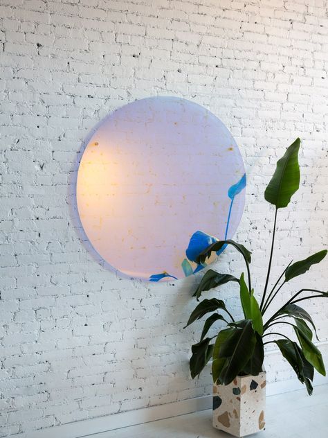 An iridescent mirror hanging on a white brick wall Iridescent Decor, White Brick Wall, Rose Mirror, Wall Brick, Tinted Mirror, Colored Mirror, Elegant Mirrors, Traditional Mirrors, Translucent Glass