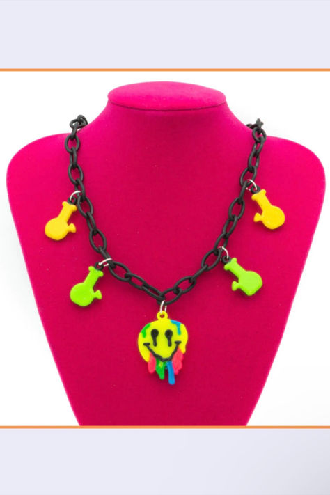 This necklace is made out of plastic chains with custom trippy smiley charms. We carefully make our custom necklaces with high-quality materials for long-term durability. Each one is individually inspected to ensure it meets our standards. Trippy Smiley Face, Neon Alien, Smiley Necklace, Smiley Face Necklace, Necklace Styles, Custom Necklaces, Trippy Designs, Rave Gear, Face Necklace