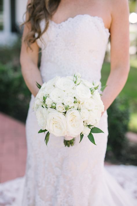 | white rose bridal bouquet | tight, white bouquet | round, white bouquet | formal white bouquet | classy white bouquet | brides of north texas | white wedding flowers | 2018 wedding bouquet | elegant bridal details | wedding day | photo taken at THE SPRINGS Event Venue. follow this pin to our website for more information, or to book your free tour! SPRINGS location:  Rockwall Manor in Rockwall, TX photographer:  Savannah Peterson Photography #bouquet #weddingflowers #whitewedding #weddinginspo Round White Bouquet Wedding, Round White Bouquet, Round Bridal Bouquet, Bouquet Shapes, Wedding Bouquet Elegant, Bride With Bouquet, Bride Bouquets White, White Rose Bridal Bouquet, White Rose Wedding Bouquet