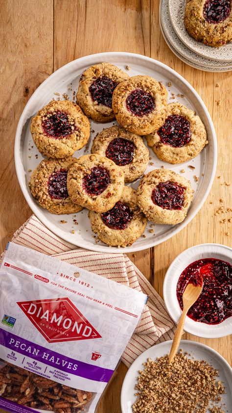 Pecan – Raspberry Linzer Thumbprint Cookies on DiamondNuts.com #DiamondNuts Linzer Bars, Pecan Thumbprint Cookies, Mexican Drink Recipes, Raspberry Thumbprint, Raspberry Thumbprint Cookies, Mexican Drinks, Thumbprint Cookies, Electric Mixer, Baking Sheets