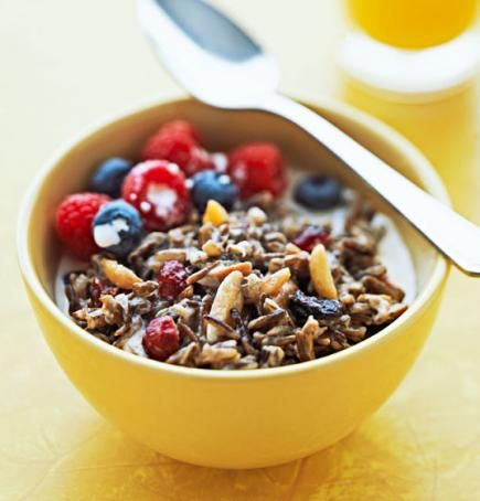 Grammy's Wild Rice Porridge | Wild rice may seem like an unusual breakfast ingredient, but it adds chewiness to this fruit-nut hot cereal. Dried cranberries, blueberries and cherries also cook into the porridge. Rice Breakfast, Wild Rice Recipes, Hot Desserts, Maple Syrup Recipes, Best Brunch Recipes, Healthy Version, Rice Porridge, Breakfast And Brunch, American Recipes