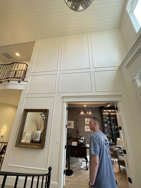 Molding On Tall Walls, Entryway Paneling Entrance, 2 Story Wall Paneling, Tall Ceiling Foyer, Tall Foyer Wall Decor High Ceilings, High Ceiling Foyer Ideas Entryway, Decorating Tall Walls High Ceilings, Entryway Wainscoting Ideas, Tall Entryway Ideas High Ceilings