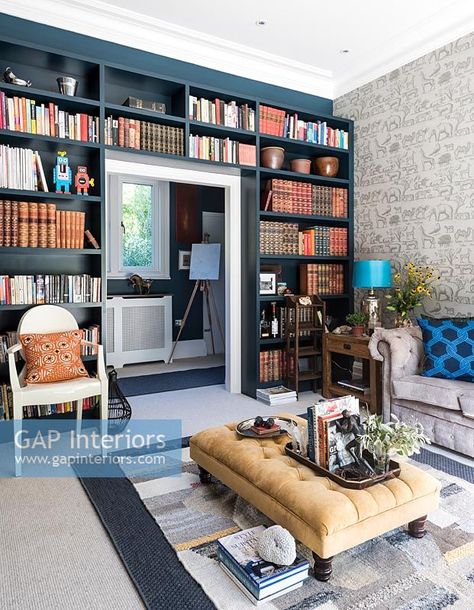 Dark blue painted wall to wall bookcases Dark Blue Painted Walls, Wall Bookcases, Painted Bookcases, Blue Bookshelves, Half Painted Walls, Painting Bookcase, Reading Rooms, Blue Painted Walls, Blue Shelves