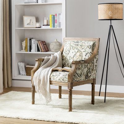 The perfect piece to reflect your novel tastes, this farmhouse armchair anchors your seating ensemble in timeless appeal. Providing you with a rich choice in terms of pattern, this piece is wrapped with polyester blend fabric for a hint of textural appeal and features both stripe and vivid floral patterns in different specific chairs. Built with the clean lines of contemporary aesthetics, it features exceptional, long-lasting details like painstakingly designed carved legs and subtly curved arms Antique Accent Chair, Comfy Accent Chairs Farmhouse, Small Accent Chairs For Living Room, Cottage Armchair, English Cottage Armchair, Farmhouse Living Room Chairs Accent Chairs & Armchairs, Farmhouse Armchair, Antique Wooden Chairs, Yellow Armchair