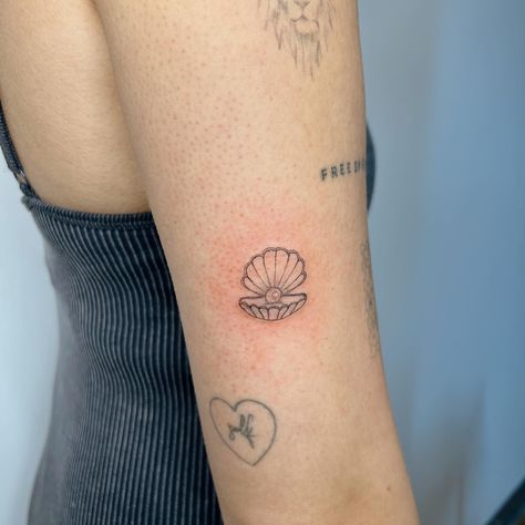 Congratulations to our giveaway winner, @libertyy.yx ! 🐚✨ This dainty shell and pearl tattoo is more than just a design—it’s a symbol of elegance, resilience, and the treasures found within. The delicate shell represents protection and beauty, while the pearl is a timeless reminder of wisdom and grace. It was an absolute honor to create this meaningful piece for you, and I hope it serves as a special reminder of your unique journey. Thank you for trusting me with this artwork! Secure your n... Pearl And Shell Tattoo, Clam Tattoo Pearl, Shell With Pearl Tattoo, Penny Tattoo, Pearl Tattoo, Shell Tattoos, Giveaway Winner, The Pearl, You And I