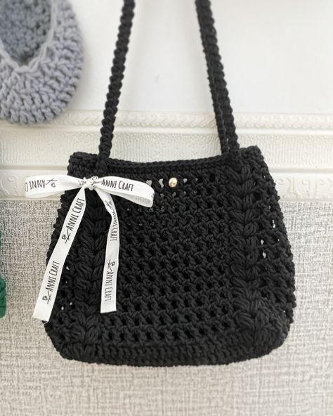 Crochet Bag in Black Specially made for my best friend, it’s been a month since she begged me to make it 🤭🤭🤭 This puffline bag by @adel__crochet is easy and fast to make yet pretty and gorgeous 😍😍 It can be a shoulder bag and cross body bag ❤️❤️❤️love it 🥰🥰 #crochetbag #shoulderbag #handmadecrochet #crossbodybag Crochet Shoulder Bags Pattern, Black Crochet Shoulder Bag, Handmade Black Crochet Bag With Double Handle, Black Crochet Bag With Double Handle, Black Crochet Shoulder Bag With Adjustable Strap, Black Crochet Bag, Crochet Cross Body Bag, Luxury Black Crochet Shoulder Bag, Handbags Patterns