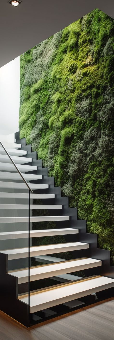 A stunning natural and modern staircase design, featuring a beautiful and lush moss wall that creates a striking and organic statement piece. This pin showcases the perfect combination of nature and modernity, infusing the space with calming greenery and creating a breathtaking and memorable feature that invites admiration and awe. Modern Staircase Design, Green Wall Design, Wall Feature, Fantasy Rooms, Gardening Techniques, Moss Wall, Modern Staircase, Sustainable Garden, Green City