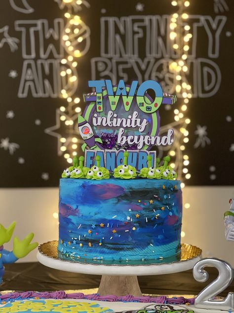 My son’s Buzz Lightyear “Two Infinity and Beyond” birthday cake for his Toy Story themed 2nd birthday party! Galaxy cake made by Gray Barn Baking. Cake topper made by SullyCreations on Etsy! Two Infinity And Beyond Birthday Buzz, Buzz Lightyear Cakes, 2 Infinity And Beyond Birthday Party Cake, Two Infinity And Beyond Cake Topper, Buzz Lightyear Cake Ideas, Buzz Cake Lightyear, Buzz Party Ideas, Buzz Light Year Birthday Cake, Two And Infinity And Beyond Birthday