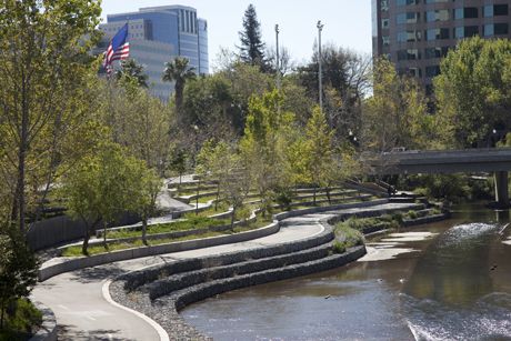 The east bank of Guadalupe River Park provides a glimpse of one of San Jose’s unique urban park settings. (Photo by Ray Rodriguez.) River Park Landscape Design, Park River, Guadalupe River, Linear Park, Riverside Park, Urban Landscape Design, Public Space Design, River Park, River Bank