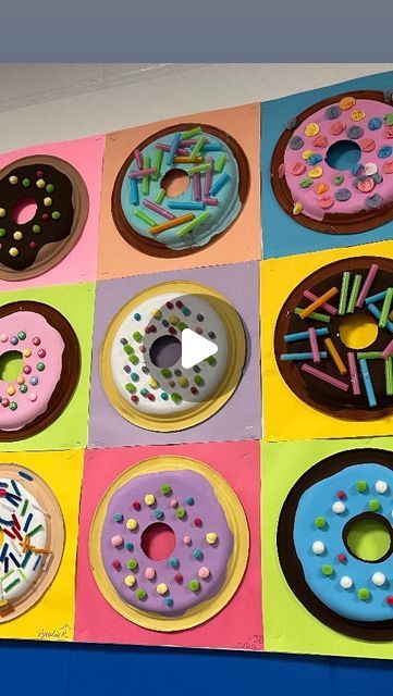 Lauralee Chambers🌀 on Instagram: "Time to share the donuts!!!

This was a really engaging and successful lesson for all 7 third grade classes! I had my husband drill holes in stacks of 10 plates with a circle drill. 10” plates are mounted on 12x12” paper with hot glue. Frosting and donuts are tempera and almost all toppings were grabbed at @retakeremake my go to for all things art! Displaying these was a game of strategy to get a variety in three rows across 36’ x3’ bulletin board. If you only see my posts, be sure to check out my stories every day!

@mychinet @retakeremake @dunkin @earthlingerin thanks for your 2017 post. I never forgot it🩷" Food Art Elementary, Paper Plate Art Projects, Paper Plate Donut Craft, Donut Activity Preschool, Paper Cookie Craft, Food Themed Art Projects For Kids, Art Class Bulletin Boards Elementary, Donut Art Project For Kids, Circle Art Preschool