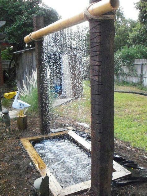 Take a stick of bamboo, hang it between two logs (or other bamboo sticks!), work some pipe magic, and get a great looking waterfall for your garden. Backyard Ponds, Taman Air, نباتات منزلية, Garden Waterfall, Waterfalls Backyard, Diy Yard, Backyard Projects, Water Feature, Outdoor Shower