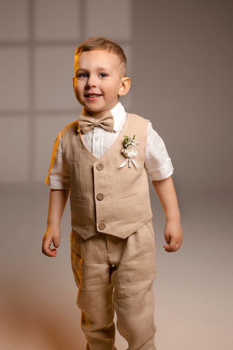 Linen ring bearer outfit: pants, vest, suspenders, bow tie and shirt. Boys Ring, Ring Bearer Suit, Suspenders Outfit, Vacation Dresses Beach, Tan Suit, Bearer Outfit, Baptism Outfit, Ring Bearer Outfit, White Linen Shirt