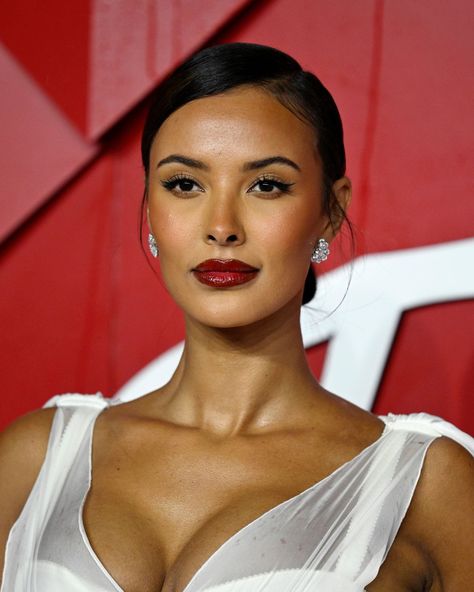 The Most Striking Beauty Looks From the Fashion Awards 2023 | Who What Wear UK Deep Red Lipstick Makeup Look, Red Lip Eyeliner, Make Up With Red Lipstick 2023, Dark Skin Makeup With Red Lips, Dark Skin Red Lip Makeup, Dark Feminine Makeup Red Lips, Deep Red Lip, 2023 Products, Red Lipstick Makeup Looks