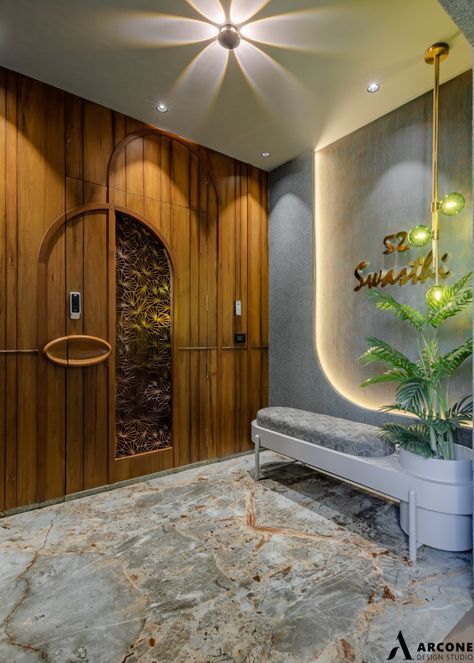 "Swasthi" - A Contemporary And Luxurious House For A Modern Indian Family | Arcone design studio - The Architects Diary Indian Home Main Door Design, Luxury Main Door Design Entrance, Vestibule Design Modern, Home Entry Design Entrance, Flat Entry Design, Entry Foyer Design Ideas, Luxury Safety Door Design, House Entry Door Designs, Flat Entrance Design Modern Luxury