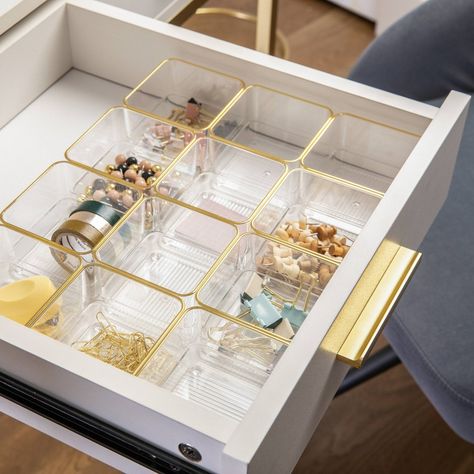 Thoughtful, functional storage is at your fingertips with this 12 pack of 3" x 3" Martha Stewart Kerry Stackable Organizers. Clear, BPA-free plastic bins are elevated by beautiful gold trim and can be configured on demand for a custom fit in a drawer or on top of your work surface. Recessed bottoms allow the components to slide from side to side for quick access and stack vertically making them an ideal storage solution for small spaces. Non-slip feet ensure these organizer trays stay where you Office Desk Drawer, Desk Drawer Organizers, Martha Stewart Home, Desk Dividers, Gold Desk, Organized Desk Drawers, Desk Drawer, Plastic Bins, Drawer Organizers