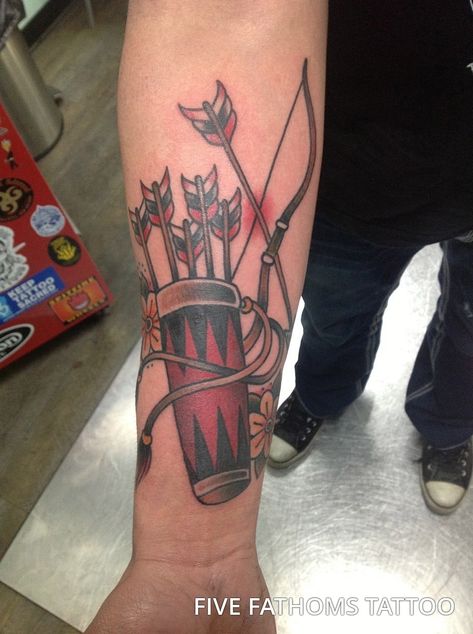 While most bow and arrow tattoo ideas feature a single arrow being drawn back in a bow this guy puts a different spin on the idea by including an entire quiver of arrows, inked in a beautiful bright red and with flowing leather straps.  #tattoos #tattoofriday #tattooart #tattoodesign #bowandarrowtattoomeaning |arrow#bowandarrowtattooideas #bowandarrowtattoo  #crossbowtattoo #bowandarrowwristtattoo #bowandarrowtattoosforguy Bow And Arrow Tattoos, Arrow Tattoos For Men, Arrow Tat, Crossed Arrow Tattoos, Infinity Arrow Tattoo, Mens Arrow Tattoo, Arrow Tattoo Finger, Compass Tattoo Meaning, Arrow Tattoo On Wrist