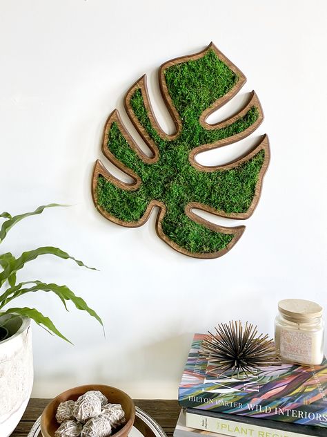 Planthropy's Moss Monstera leaf is made with beautiful sheet moss and is completely maintenance-free. Our sustainably harvested premium moss has been preserved to maintain its soft textures and vibrant, marbled coloring. The perfect home decor and a great gift for the plant lover in your life! #wallart #walldecor #plantlover #plantlady #giftsforher #natureart #homedecorinspo Calm And Peace, Drawing Room Furniture, Handmade Sheet, Labyrinth Design, Moss Wall Art, Biophilic Design, Moss Art, Preserved Moss, Moss Wall