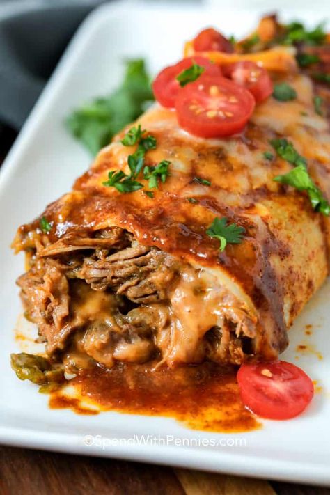 Crockpot beef burritos are a simple meal to set and forget. Just make the shredded beef but slow cooking it all day, then wrap inside a tortilla with refried bean and other Mexican toppings. Top with cheese and bake to create an irresistibly cheesy authentic beef bean burrito! #spendwithpennies #slowcookerbeefburritos #slowcooker #crockpot #beefrecipe #Mexican #maindish Baked Burritos Beef, Shredded Beef Burrito Recipes, Beef Bean And Cheese Burritos, Bean And Beef Burritos, Shredded Beef Burritos, Mexican Toppings, Slow Cooker Burrito, Beef And Bean Burritos, Beef Burrito Recipe