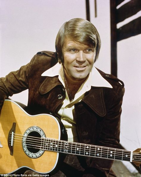 Legend: Campbell was one of the biggest stars of the late 1960s and 1970s. He sold more than 45 million records, had 12 gold albums and 75 chart hits Glen Campbell Rhinestone Cowboy, Elvis Performing, Vintage Dolly Parton, 1990s Music, Ovation Guitar, Marty Robbins, Rhinestone Cowboy, Glen Campbell, Kenny Rogers