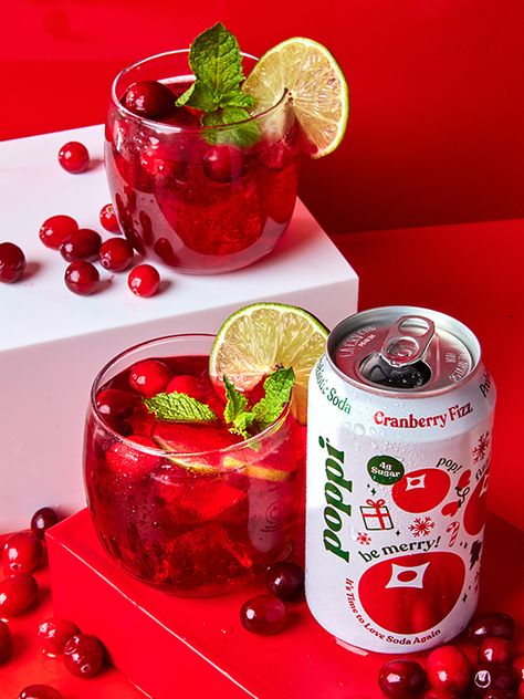 This punch bowl cocktail is perfect for holiday gatherings of all sizes. Cranberry Fizz soda by poppi provides just the right amount of bubbles. Mixed with pomegranate juice, gin and orange liqueur, it's a festive sipper and easy crowd pleaser. For a mocktail version, omit the alcohol and add in some orange and cranberry-apple juice. Get the Recipe and try it with Cranberry Fizz soda by poppi! Cranberry Fizz Poppi Mocktails, Cranberry Poppi Drink, Cranberry Fizz Poppi, Cranberry Fizz Poppi Cocktails, Poppi Soda Cocktail, Poppi Soda Cocktail Recipe, Cocktails With Poppi Soda, Poppi Drink Mocktails, Poppi Soda Mocktail