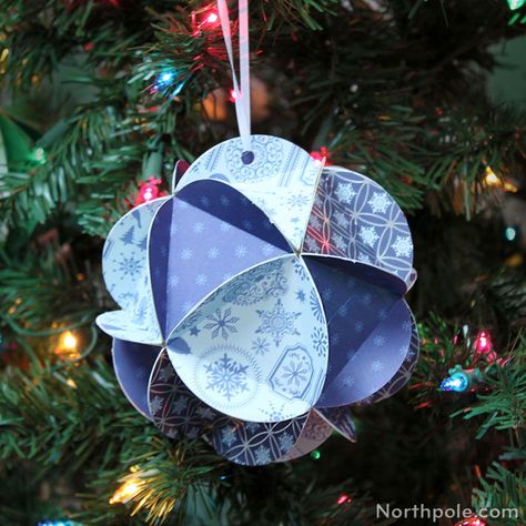 Make this super-cute icosahedron out of cardstock, old Christmas cards, gift bags, or even gift boxes. Full DIY on northpole.com/craftcottage #christmascraft #christmasornament #ornament #christmas #handmade Cardstock Ornaments, Picture Christmas Ornaments, Craft Cottage, Paper Christmas Decorations, Paper Christmas Ornaments, Diy Christmas Tree Ornaments, Festive Crafts, Christmas Time Is Here, Christmas Crafts For Gifts