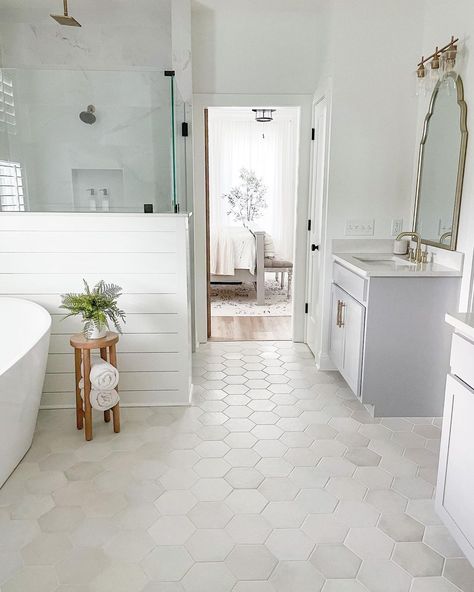 Loving how @thewhitehouseonpineridge used white marble white hexagon tiles in this stunning bathroom floor!⁣ ⁣ #masterbathroom⁣ #bathroomdesign⁣ #bathroomremodel⁣ Airy Bathroom, Hexagon Floor Tiles, Hexagon Tile Bathroom, White Hexagon Tiles, All White Bathroom, Hexagon Floor, Shiplap Walls, White Bathroom Tiles, Eclectic Bathroom