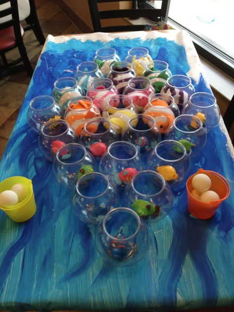 This fun under the sea themed game was found online at a party supply website… Finding Nemo Party Games, Sea Themed Party Favors, Fish Bowl Toss, Finding Nemo Games, Dory Birthday, Dory Party, Carnival Games For Kids, Bubble Guppies Birthday Party, Underwater Party