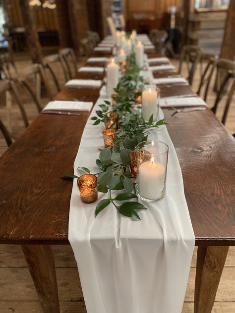 Candle And Greenery Table Decor, Rustic Wedding Centerpieces Rectangle Tables, Long Table Wedding Centerpieces Rustic, Fall Garland Centerpieces For Table, Simple Engagement Table Decor, Rustic Table Setting White Table Cloth, Boho Wedding Candles Table Settings, How To Decorate Rectangle Tables Wedding, Round Boho Table Setting