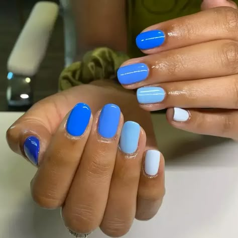 40+ Cute Blue Nail Designs You'll Love - StylePersuit Dark Blue To Light Blue Nails, Multi Colored Blue Nails, Fun Blue Nails Designs, Multi Blue Nails, Blue Dipped Nails, Powder Blue Nails Designs, Blue Gel Nails Ideas, Colorado Nails, Blue Manicure Ideas