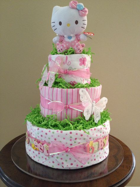 Hello Kitty diaper cake using receiving blankets Hello Kitty Diaper Cake, Diaper Cake Castle, Zoe Core, Cake Hello Kitty, Hello Kitty Baby Shower, Cake Castle, Pamper Cake, Hello Kitty Core, 19 Birthday