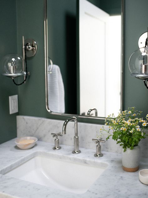 We get asked all the time where to use dramatic paint colors, and one of our answers is “in a bathroom”! Bathrooms are a great place to add personality and color. We used this fun green color in the upstairs bath. With white walls, this bathroom wouldn’t be the same… It needed some color! We love the fun and unexpected pop! Green And Silver Bathroom, White Chrome Bathroom, Green And Chrome Bathroom, Pewter Green Bathroom Vanity, Chrome Bathroom Ideas, Green Bathroom With Silver Fixtures, Green Color Drenched Bathroom, Green Bathroom Chrome Fixtures, Green Bathroom Vanity With Chrome