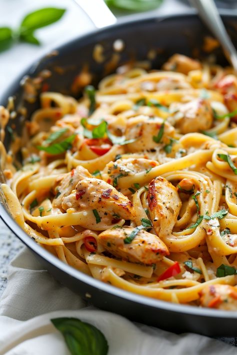 Indulge in a flavorful dinner tonight with this delicious Cajun Chicken Pasta recipe. Perfectly seasoned chicken, tender veggies, and al dente pasta come together in a creamy Cajun sauce for a meal that's sure to satisfy your taste buds. This easy-to-make dish is ideal for busy weeknights or weekends when you want something comforting yet exciting. Treat yourself and your loved ones to the bold flavors of this Cajun Chicken Pasta – you won't be disappointed! Cajun Chicken Linguine Alfredo, Cajun Chicken Pasta Bake, Best Cajun Pasta, Tgi Fridays Cajun Chicken Pasta Recipe, Cajun Spaghetti Recipes, Cream Of Chicken Pasta Recipes, Cajun Chicken Linguine, Cabana Recipes, Chicken Broccoli Alfredo Pasta