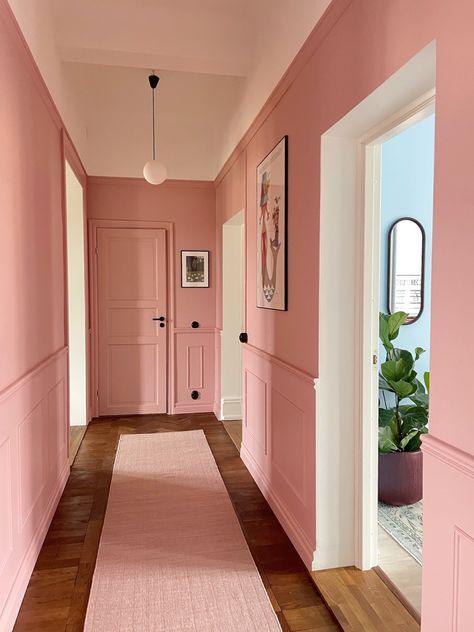 Dusty pink hallway in Swedish apartment Bright Pink Hallway, Hallways Colour Ideas, Pink Ceiling Hallway, Pink Baseboards And Trim, Pink Entrance Hall, Colourful Door Frames, Victorian Landing Upstairs, Corridor Color Walls, Dusky Pink Hallway