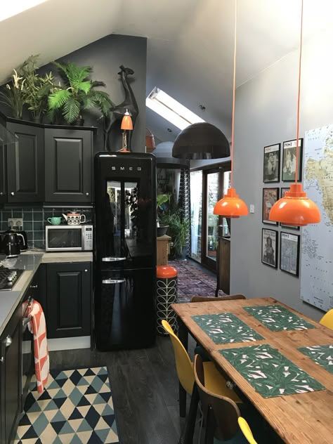 Eclectic Black Kitchen, Orange Smeg Fridge Kitchen, Moody Eclectic Decor Kitchen, Black Kitchen Vintage, Edgy Kitchen Decor, Orange And Black Kitchen, Black Tiny House Interior, Black Tiny Kitchen, Edgy Kitchen Design