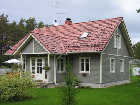 Grey wood house, exterior, squared windows, red roof Red Roof Gray House, Red Shingle Roof Exterior Colors, Red Roof Grey House, Grey House With Red Roof, Red Shingles House Colors, House Colors With Red Roof, House Exterior Red Roof, Red Metal Roof Houses Color Combos, Red Roof House Colors Home Exteriors