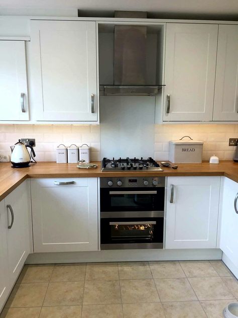 White shaker style kitchen with oak block laminate worktops #venuekitchens Cream Kitchen With Wooden Worktop, Light Oak Worktop Kitchen, White Shaker Kitchen Oak Worktop, White Kitchen Oak Worktop, White Kitchen Wooden Worktop, Oak Kitchen Worktop, White Gloss Kitchen Wood Worktop, Small White Kitchen Wooden Worktop, White Shaker Kitchen Ideas