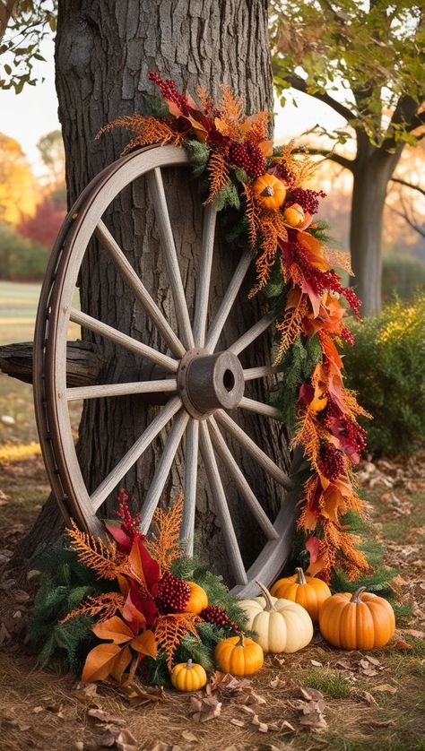 Make your home festive and fun with outdoor fall decor ideas. Perfect for welcoming guests and celebrating the fall season. Fall Yard, Pumpkin Outdoor Decor, Wagon Wheel Decor Outdoor, Fall Wagon Decor, Wagon Wheel Decor, Outdoor Fall Decor Ideas, Backyard Area, Wheel Decor, Front Yard Garden Design