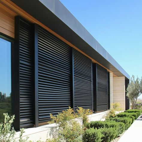 Enhance your building's look and functionality with aluminum louvered shutters! These sleek shutters provide privacy, sun control, and energy efficiency, all while adding a modern touch to any structure. Made from durable, weather-resistant aluminum, they’re ideal for sustainable designs in residential or commercial buildings. Perfect for architects and homeowners looking for stylish shading solutions. Louvers Design, Building Materials Architecture, Louvered Shutters, Building And Construction, Commercial Buildings, Energy Efficient Design, Construction Industry, Sustainable Design, Building Materials