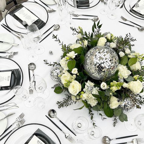 CANDY WEDDING STUDIOS. Design. Print. Hire | Not sure if you’ve noticed but disco balls are in 😂 🪩💃 Fresh florals, disco balls, our black rim chargers, cutlery, black napkins… | Instagram Disco Ball Table Centrepiece, Disco Ball Wedding Centerpiece, Disco Ball Centerpiece Ideas, Candelabra Wedding Centerpieces, Wolf Christmas, Candelabra Wedding, Candy Wedding, Black Napkins, Wonderland Christmas